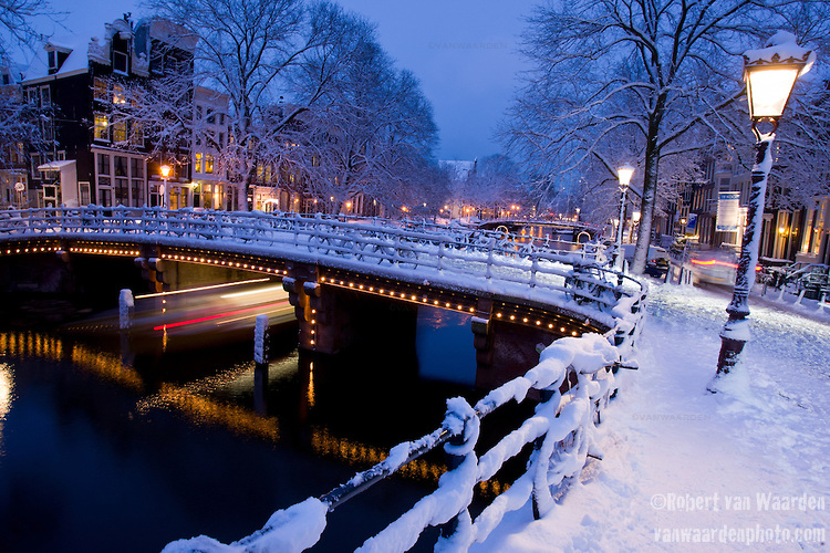 The canals in Amsterdam after a winter snow fall.